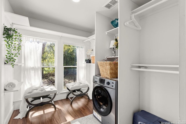 laundry area with washer / clothes dryer and hardwood / wood-style flooring