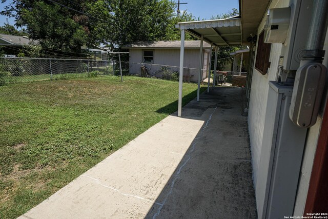 view of outdoor structure with a lawn