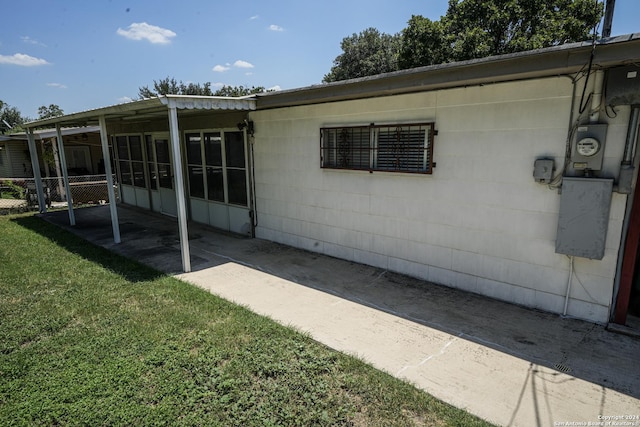 exterior space with a yard and a patio area