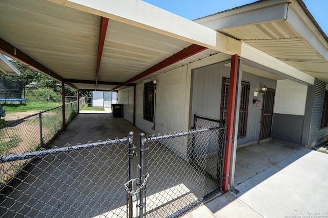 view of side of home featuring a trampoline