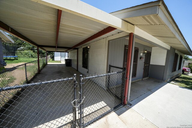 view of home's exterior with a trampoline