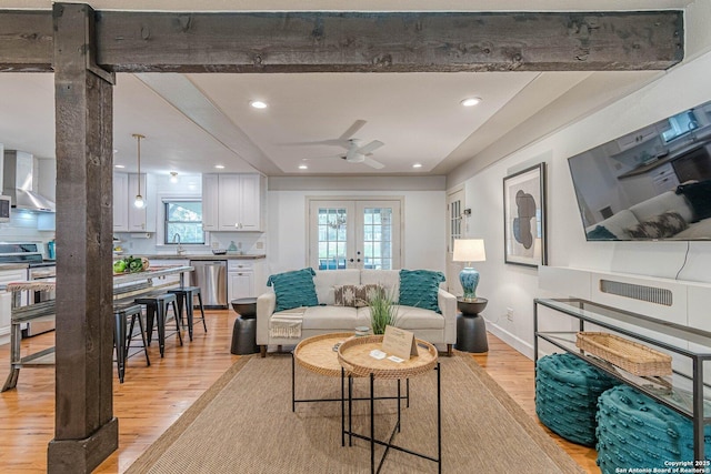 living room featuring light wood-type flooring, french doors, ceiling fan, and recessed lighting