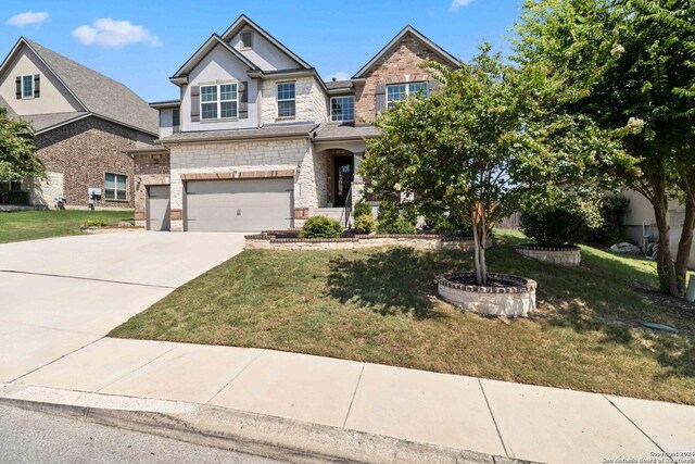 view of front facade featuring a front yard and a garage