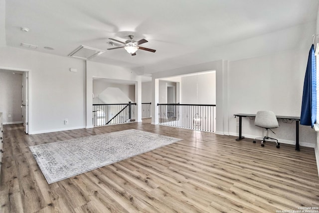 spare room with ceiling fan and light wood-type flooring