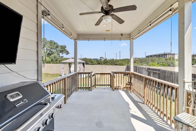 view of patio with a gazebo, area for grilling, and ceiling fan