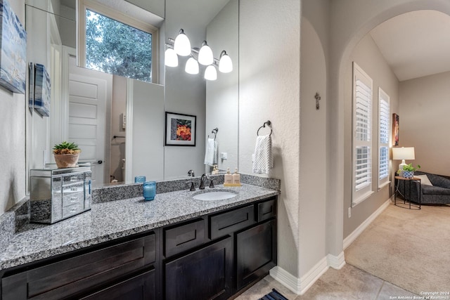 bathroom with tile patterned floors and vanity