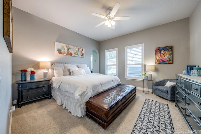 bedroom featuring ceiling fan and light carpet