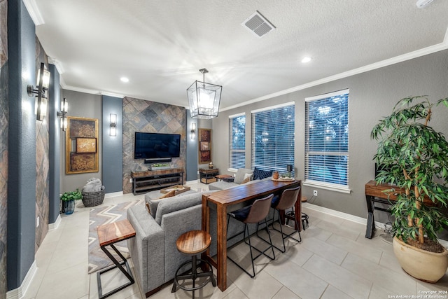 tiled living room with an inviting chandelier, ornamental molding, and a textured ceiling