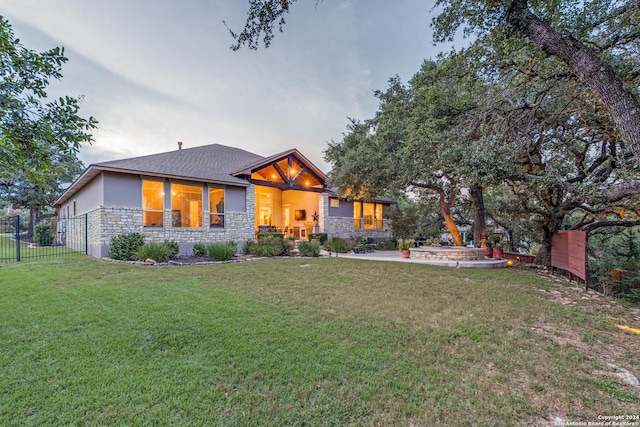 view of front facade with a yard and a patio