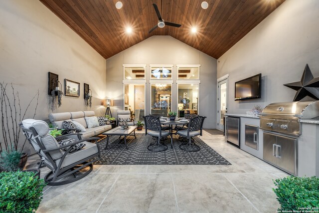 living room featuring wooden ceiling, high vaulted ceiling, and ceiling fan