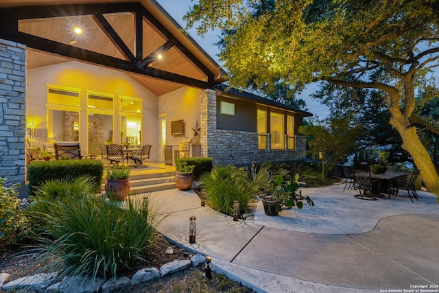 exterior space featuring exterior kitchen and a patio area