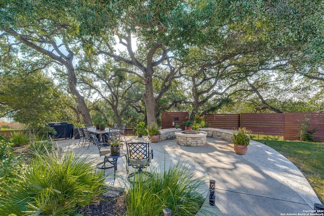 view of patio / terrace with a fire pit