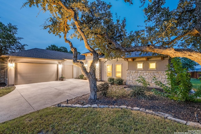 ranch-style home featuring a garage