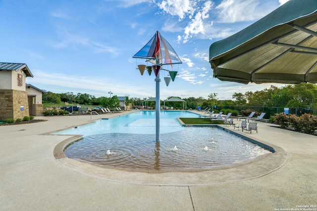 view of swimming pool featuring a patio area