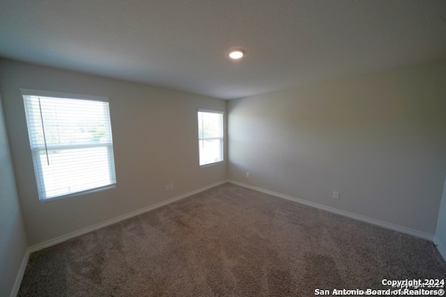 empty room featuring carpet flooring