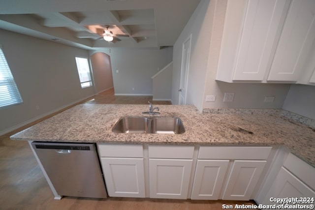 kitchen featuring white cabinetry, dishwasher, sink, and light stone countertops