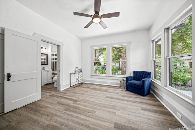 unfurnished room with ceiling fan and light hardwood / wood-style floors