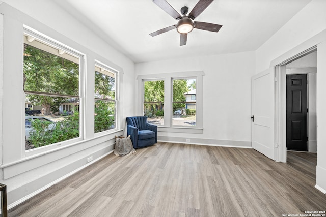 unfurnished room featuring ceiling fan and hardwood / wood-style floors