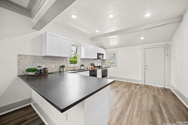 kitchen with black appliances, decorative backsplash, light hardwood / wood-style floors, and white cabinetry