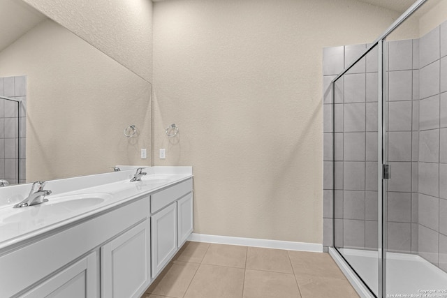 8433 Roadrunner Psge, San Antonio, TX 78222 - bathroom with a sink, tile patterned floors, double vanity, and tiled shower