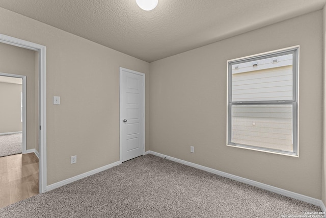 8433 Roadrunner Psge, San Antonio, TX 78222 - unfurnished bedroom featuring baseboards and carpet