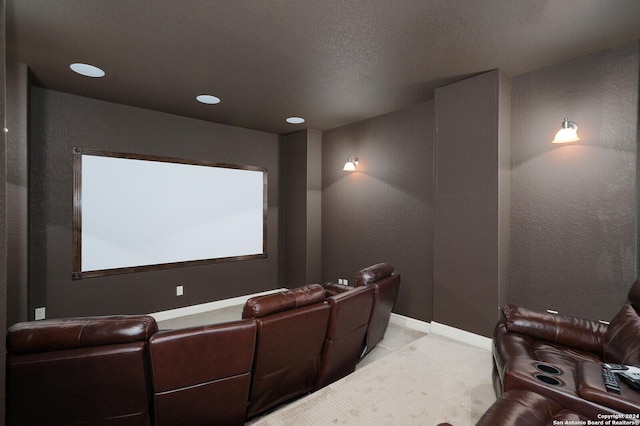 home theater room with baseboards, recessed lighting, and light colored carpet