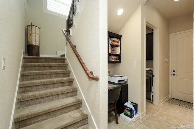 staircase featuring tile patterned floors