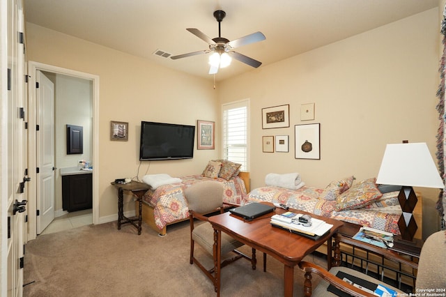 living area featuring ceiling fan, baseboards, visible vents, and light colored carpet