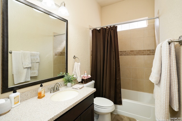 full bathroom with vanity, shower / tub combo with curtain, and toilet