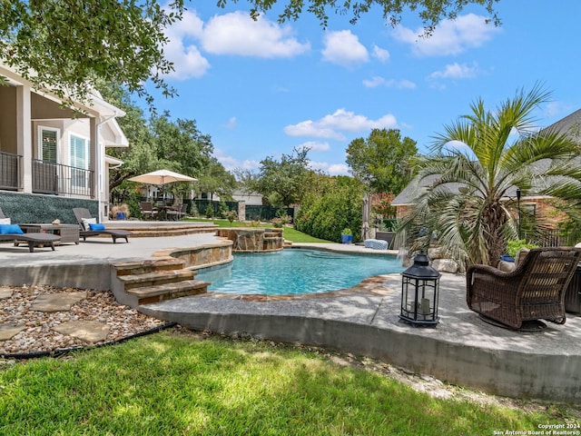 view of swimming pool with a patio area