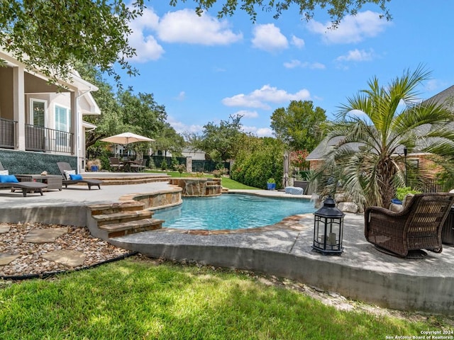 view of swimming pool featuring a patio area