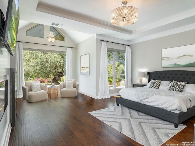 bedroom with a raised ceiling, lofted ceiling, ornamental molding, a chandelier, and dark hardwood / wood-style flooring