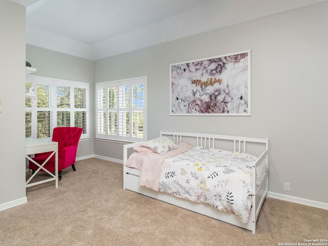 bedroom featuring light carpet