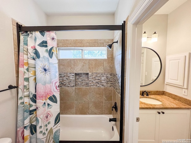 bathroom with vanity and shower / bath combo with shower curtain