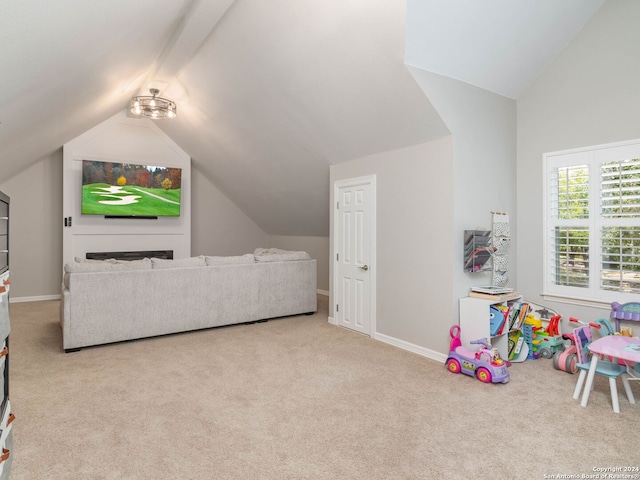 game room featuring lofted ceiling and light carpet