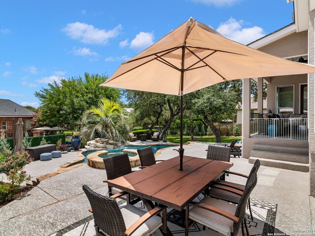 view of patio with a swimming pool with hot tub