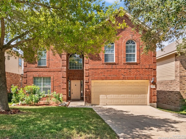 view of front facade with a garage and a front yard