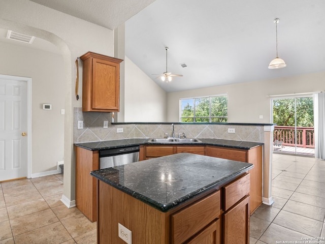 kitchen featuring dishwasher, sink, backsplash, and a healthy amount of sunlight