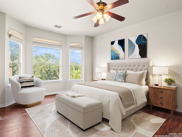 bedroom with wood-type flooring and ceiling fan