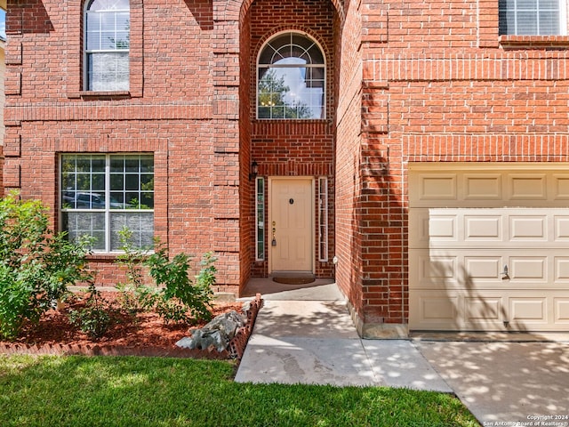 view of exterior entry featuring a garage