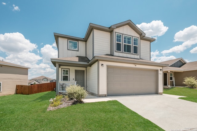 view of front of house with a front lawn, a porch, and a garage