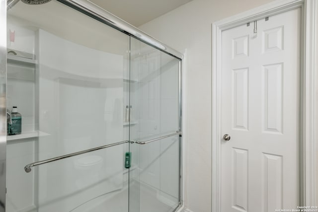 bathroom featuring an enclosed shower