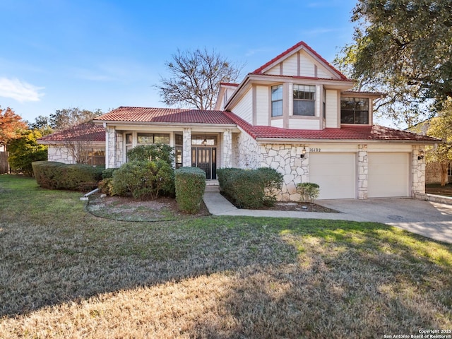 view of front of home featuring a garage and a front lawn