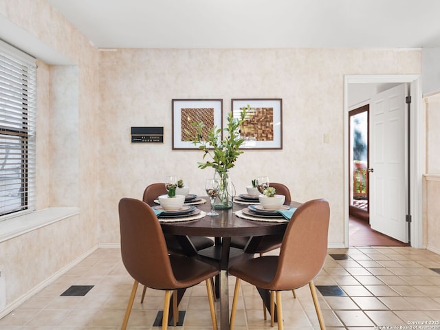 dining space featuring tile patterned flooring