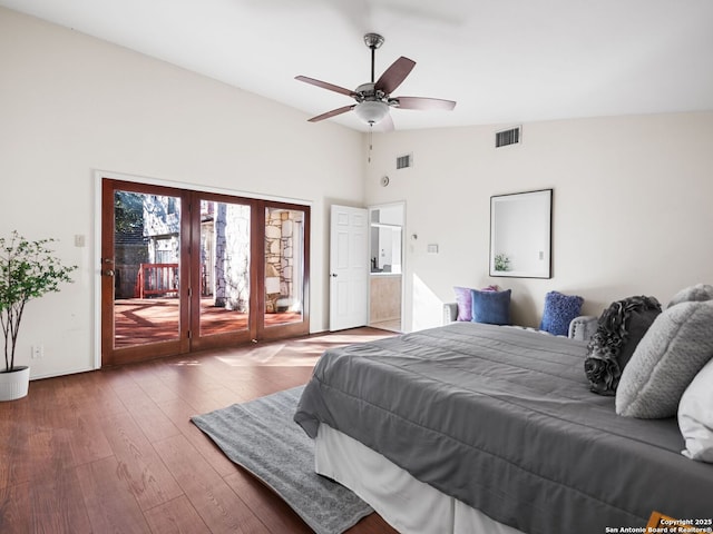 bedroom featuring ceiling fan, wood-type flooring, vaulted ceiling, and access to outside