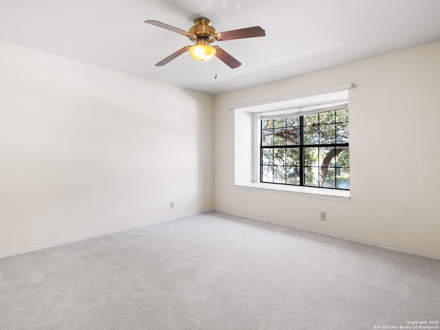 carpeted empty room with ceiling fan