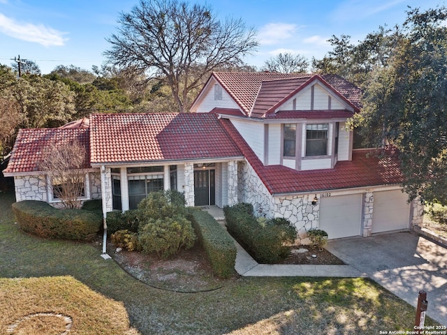 view of front of property with a garage and a front yard