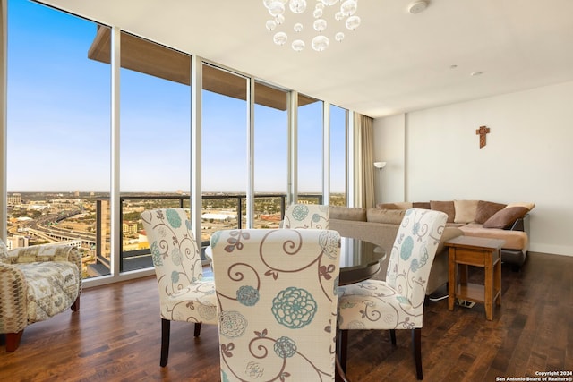 dining room featuring floor to ceiling windows and dark hardwood / wood-style flooring