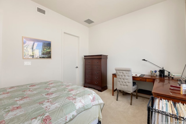 bedroom with light colored carpet