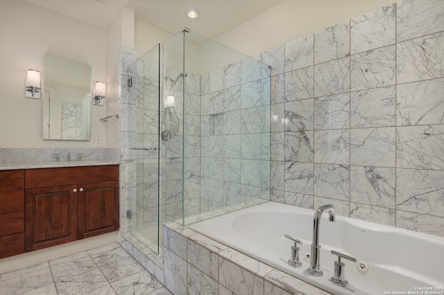 bathroom featuring vanity and shower with separate bathtub